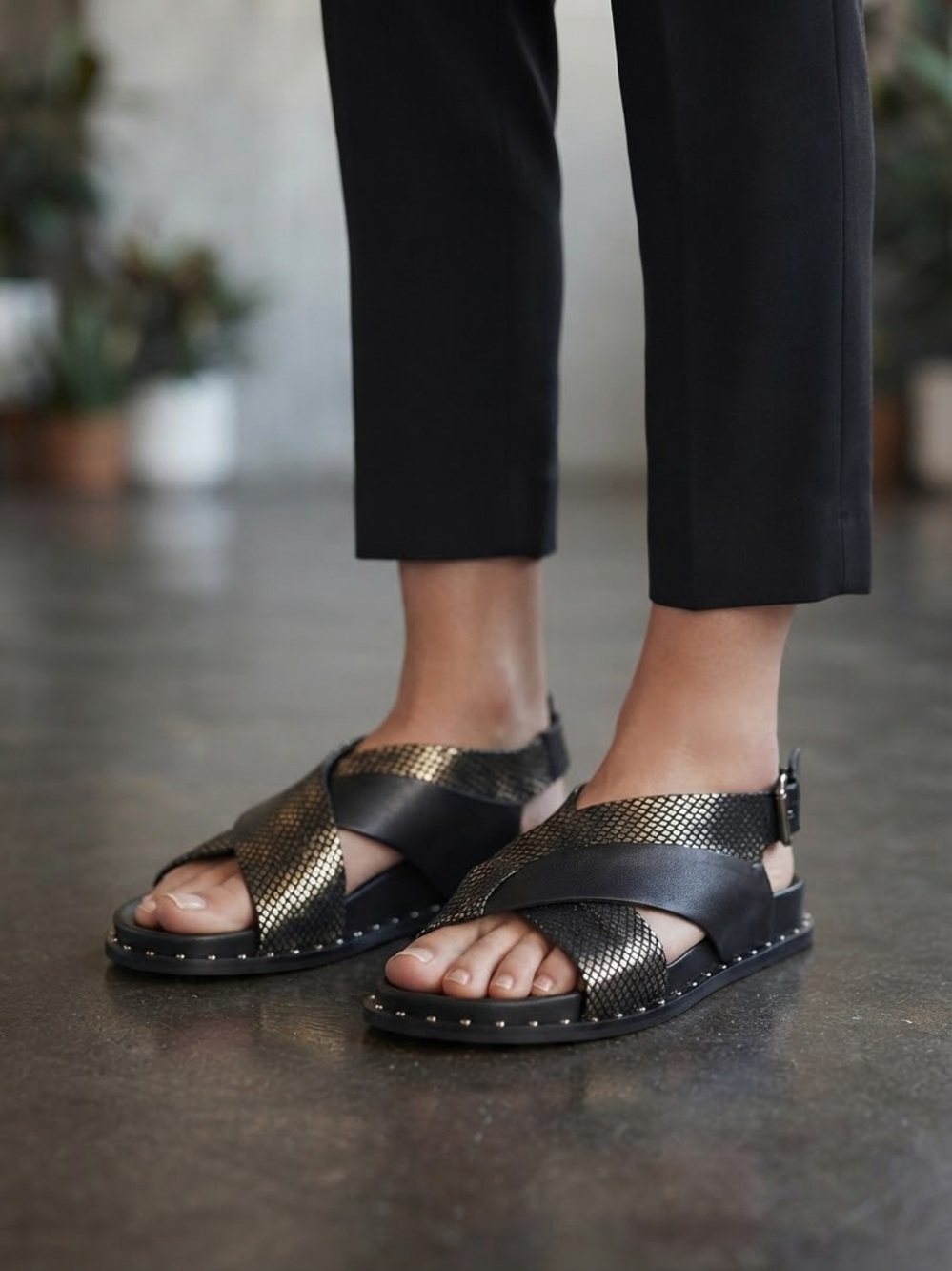 L.A.M.B. Black and Gold Crisscross Sandals